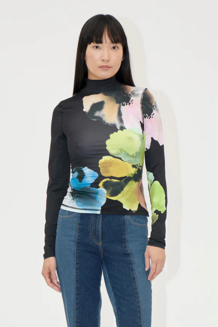 Model wearing Stine Goya Elastic High Neck Collared Top front view