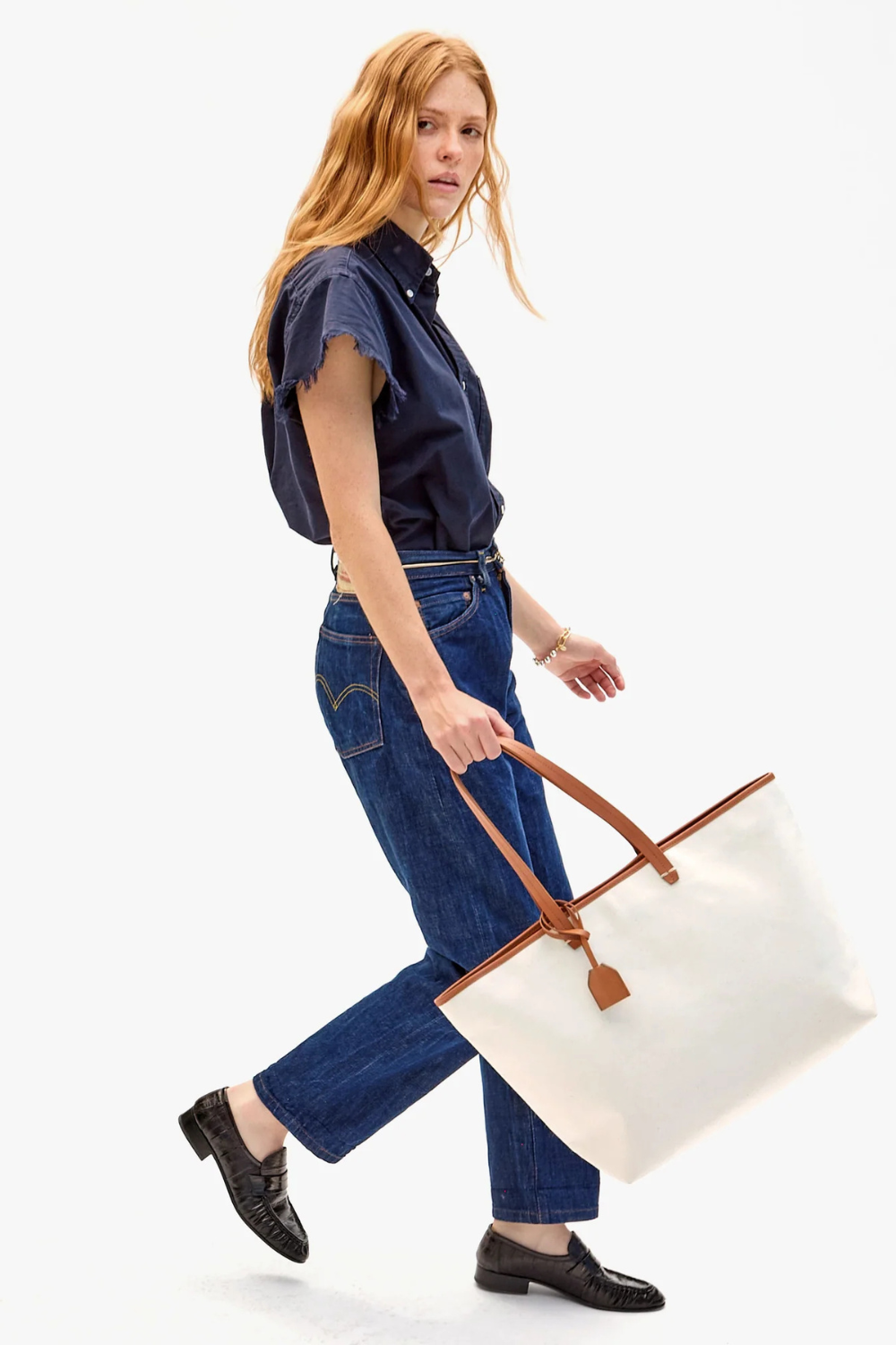 Model carrying Clare V. Volie Tote front view