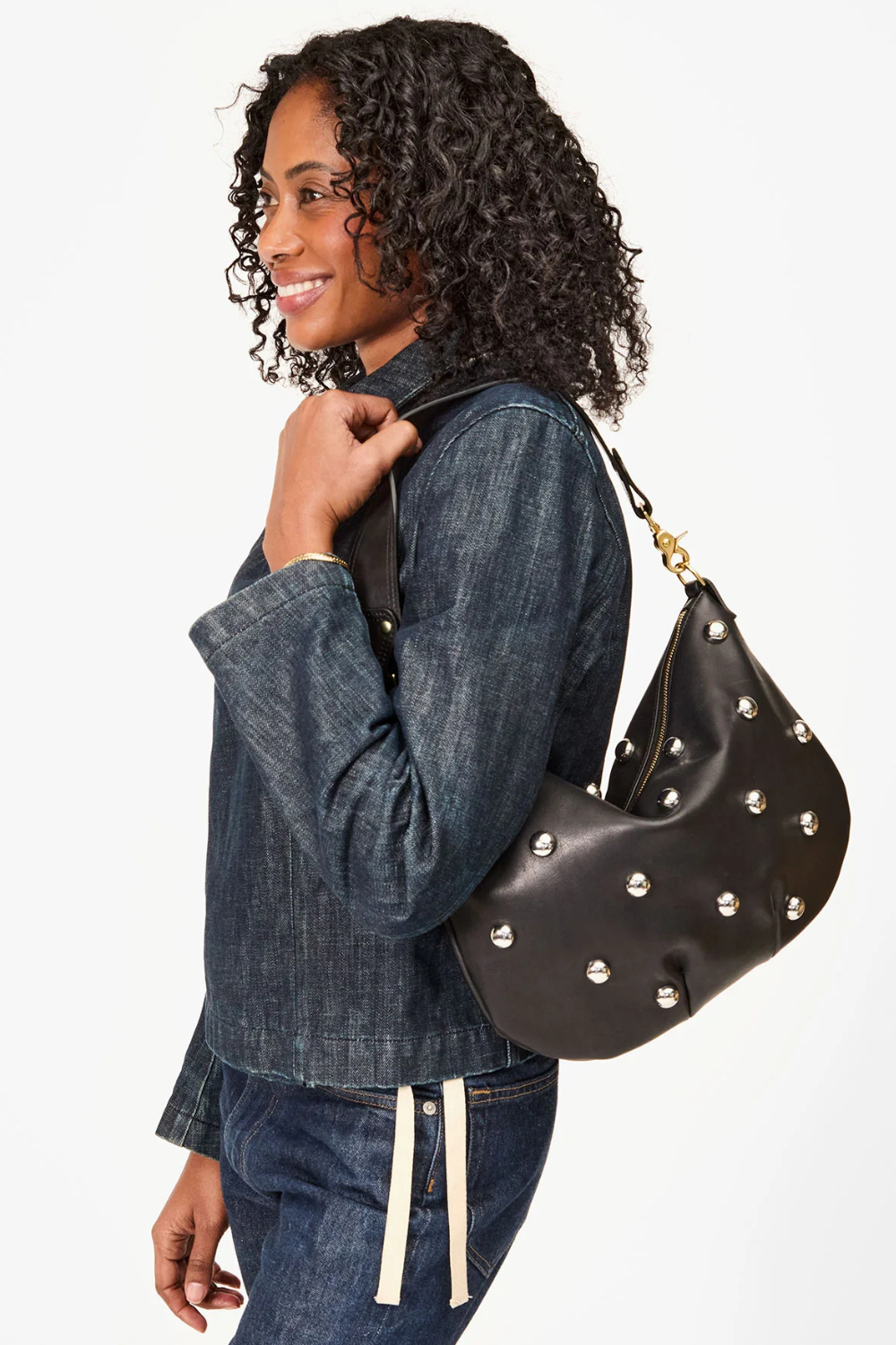 Model holding Clare V. Moyen Messenger front view