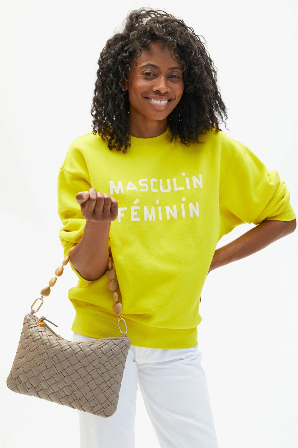 Model wearing Clare V. Flat Clutch w/ Tabs front view