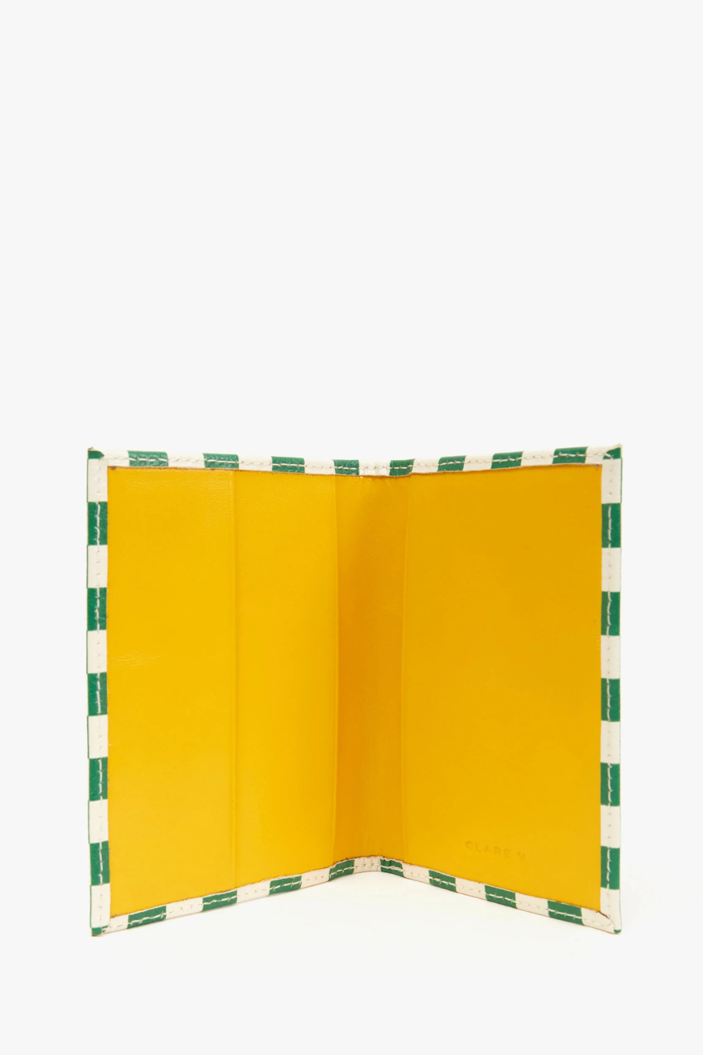 Flat lay of Clare V. Passport Sleeve opened