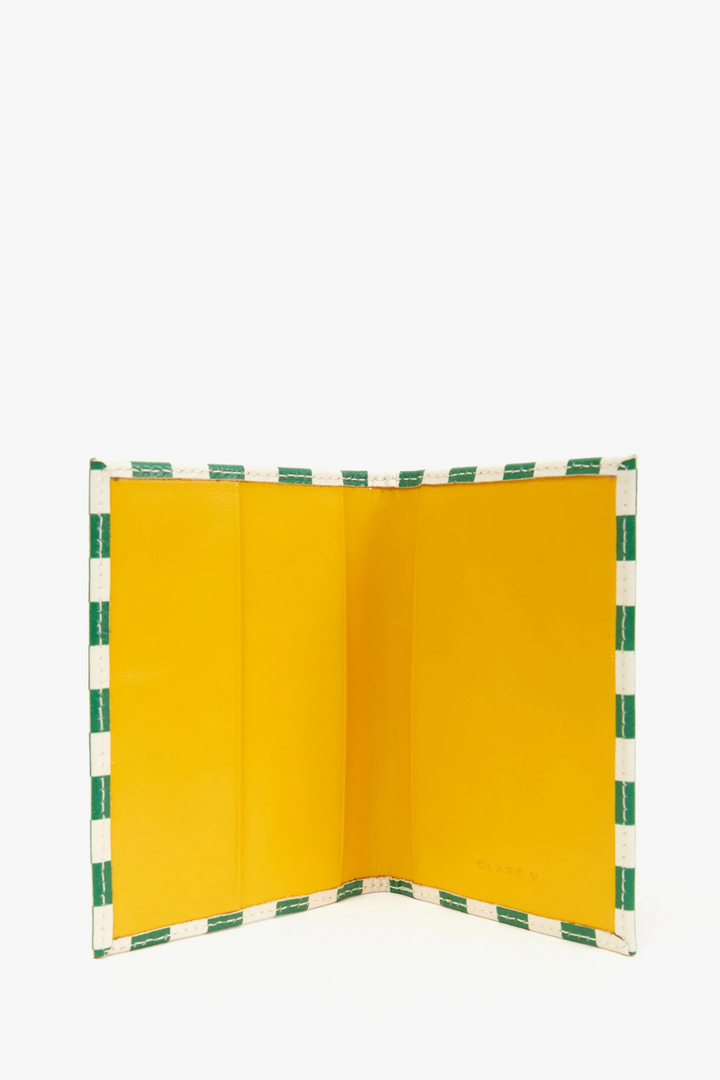 Flat lay of Clare V. Passport Sleeve opened