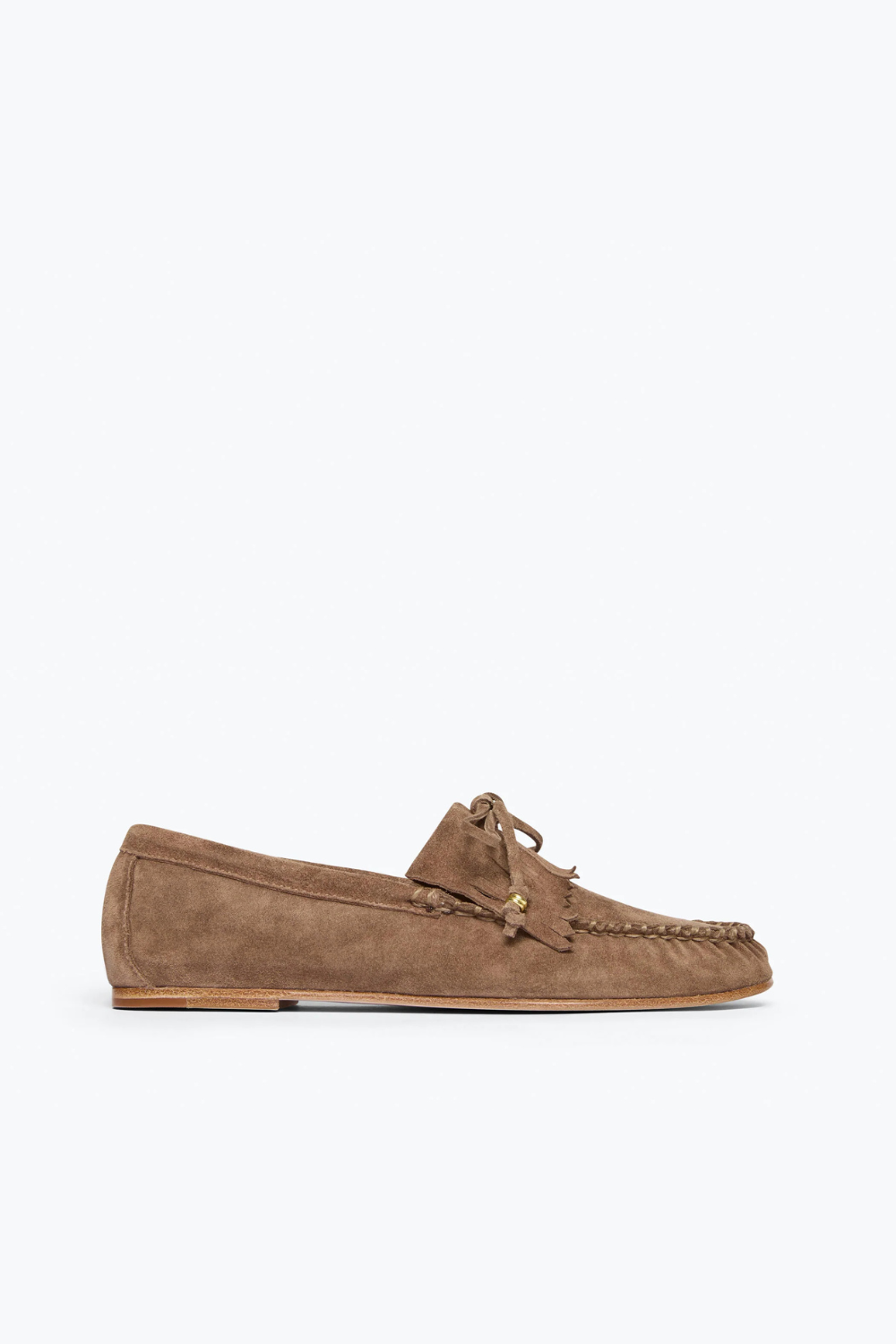 Flat lay of Frēda Salvador Celeste Low Profile Fringe side view