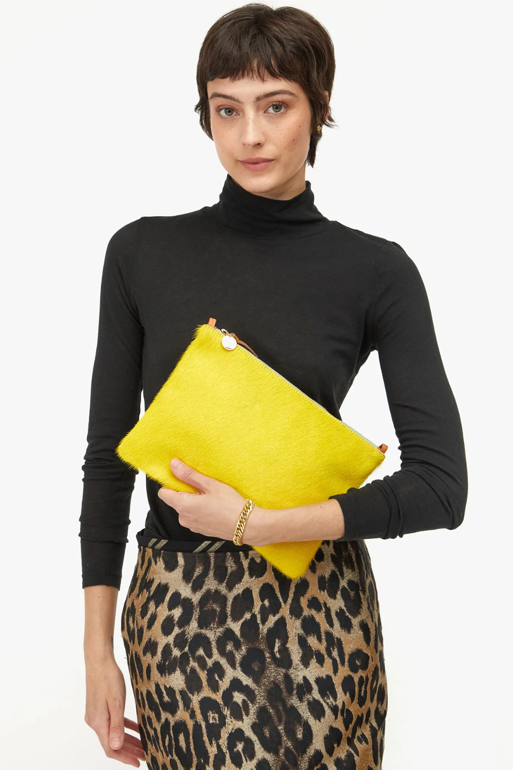 Model wearing Clare V. Flat Clutch w/ Tabs front view