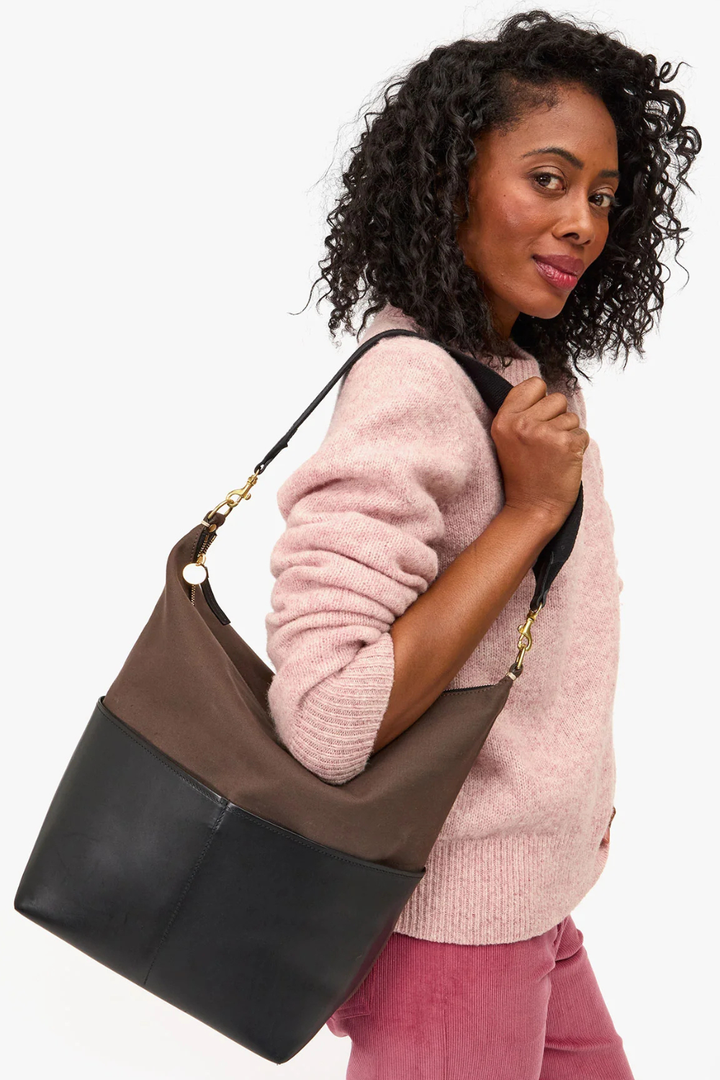 Model wearing Clare V. Canvas w/ Veg Sophie Bag front view