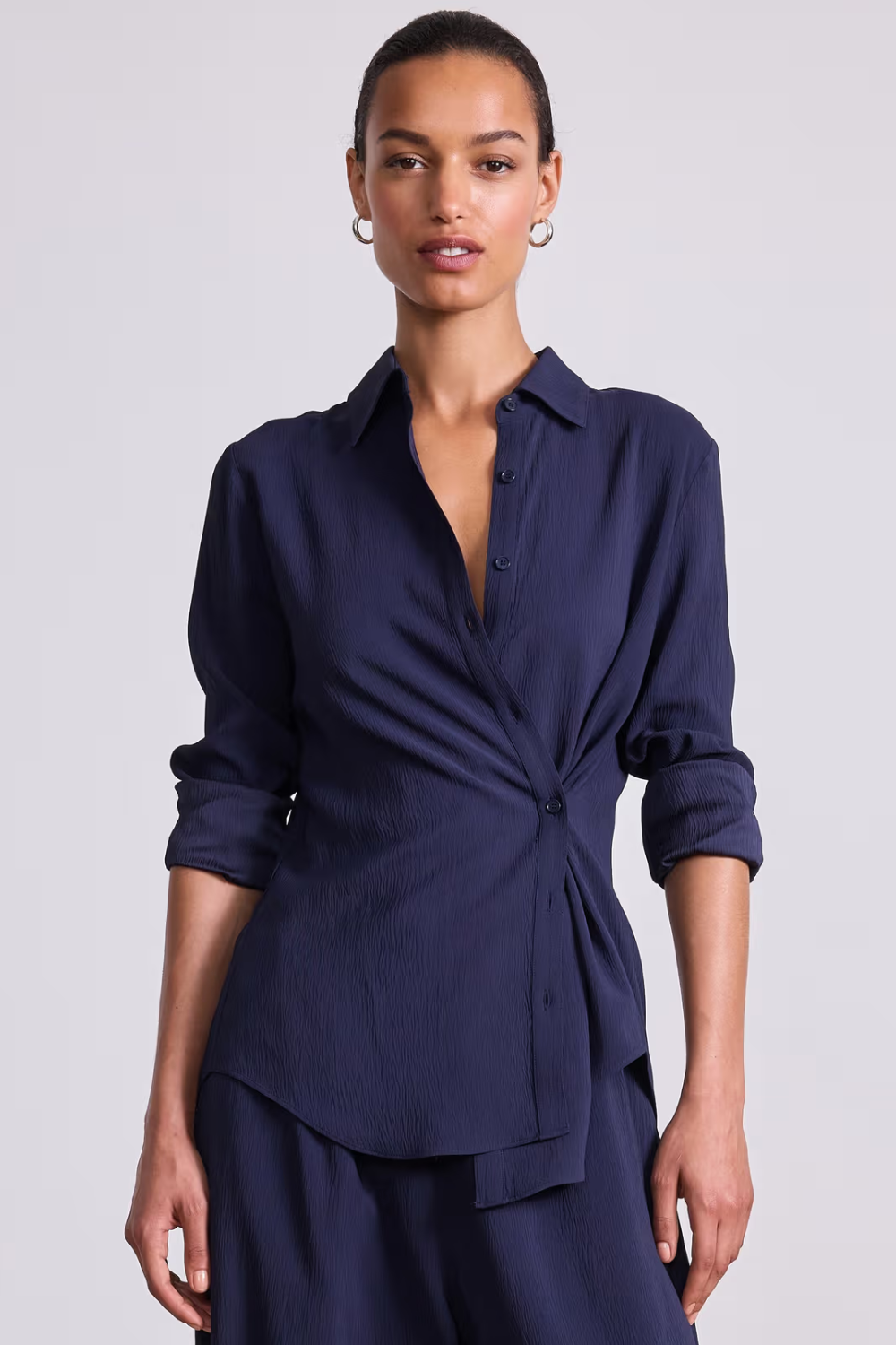 Model wearing Apiece Apart Sodi Wrap Button Up front view