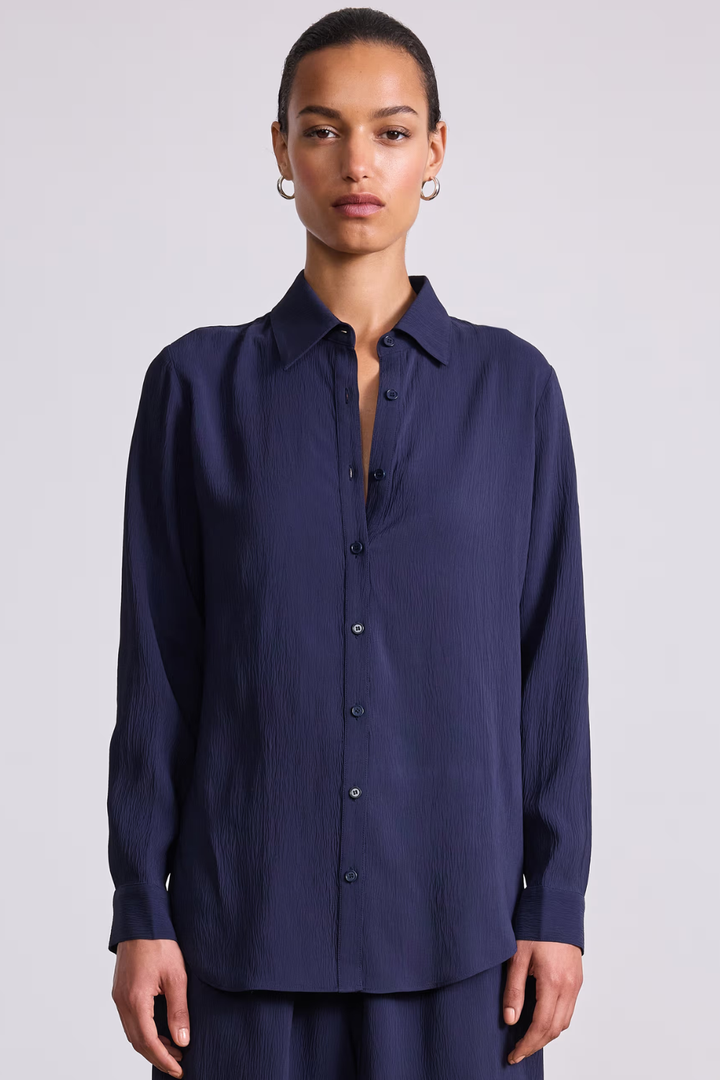 Model wearing Apiece Apart Sodi Wrap Button Up front view