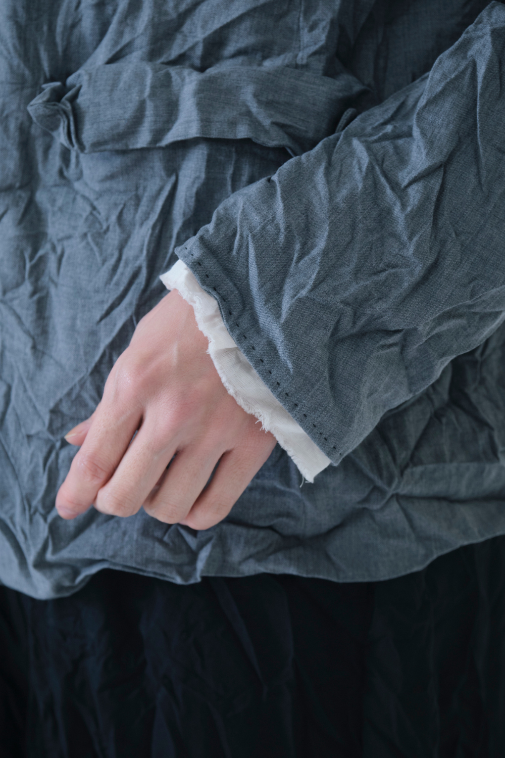 Model wearing Pas de Calais Wool Blend Twill Jacket front/sleeve view