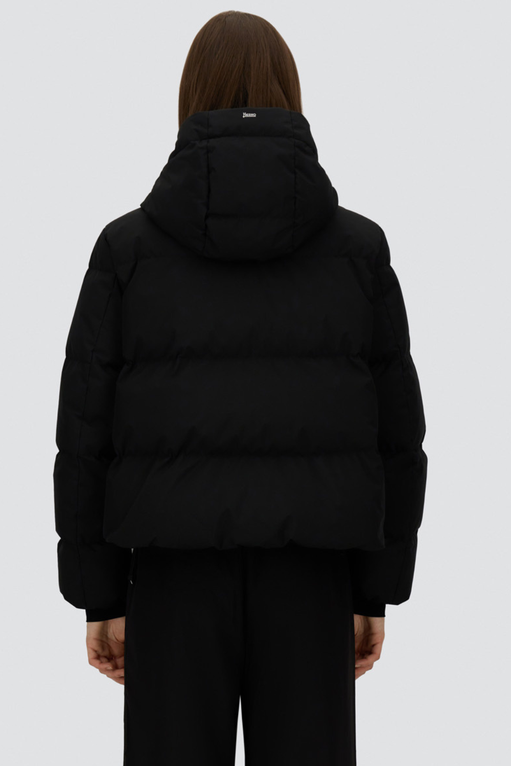 Model wearing Herno Short Hooded Puffer Coat rear view