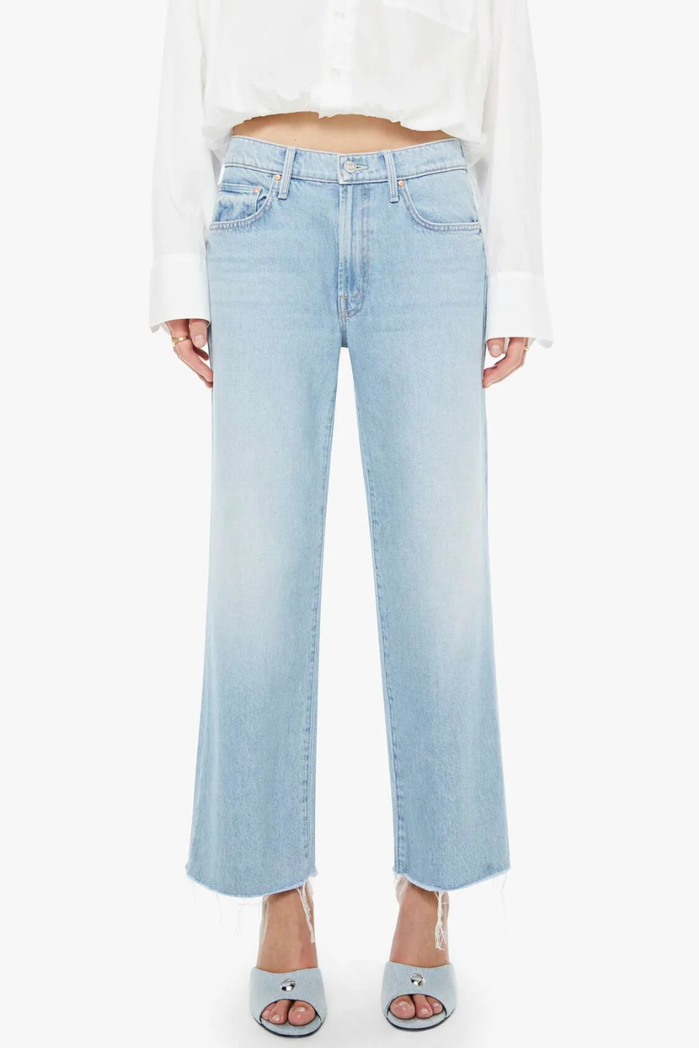 Model wearing Mother Denim Mid Rise Rambler Zip Ankle Fray front view