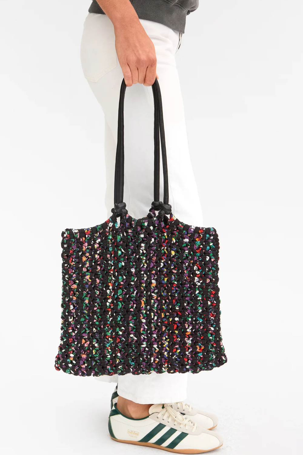 Model holding Clare V. Sandy front view