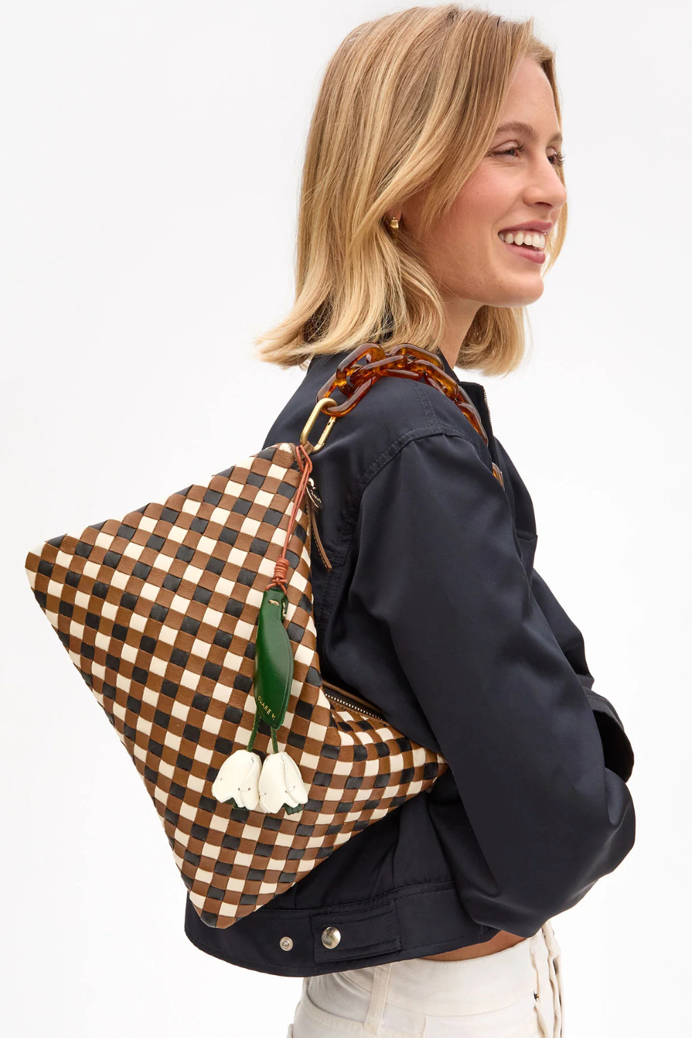 Model wearing Clare V. Flat Clutch w/ Tabs Oat Multi Medium Woven Diagonal  front view