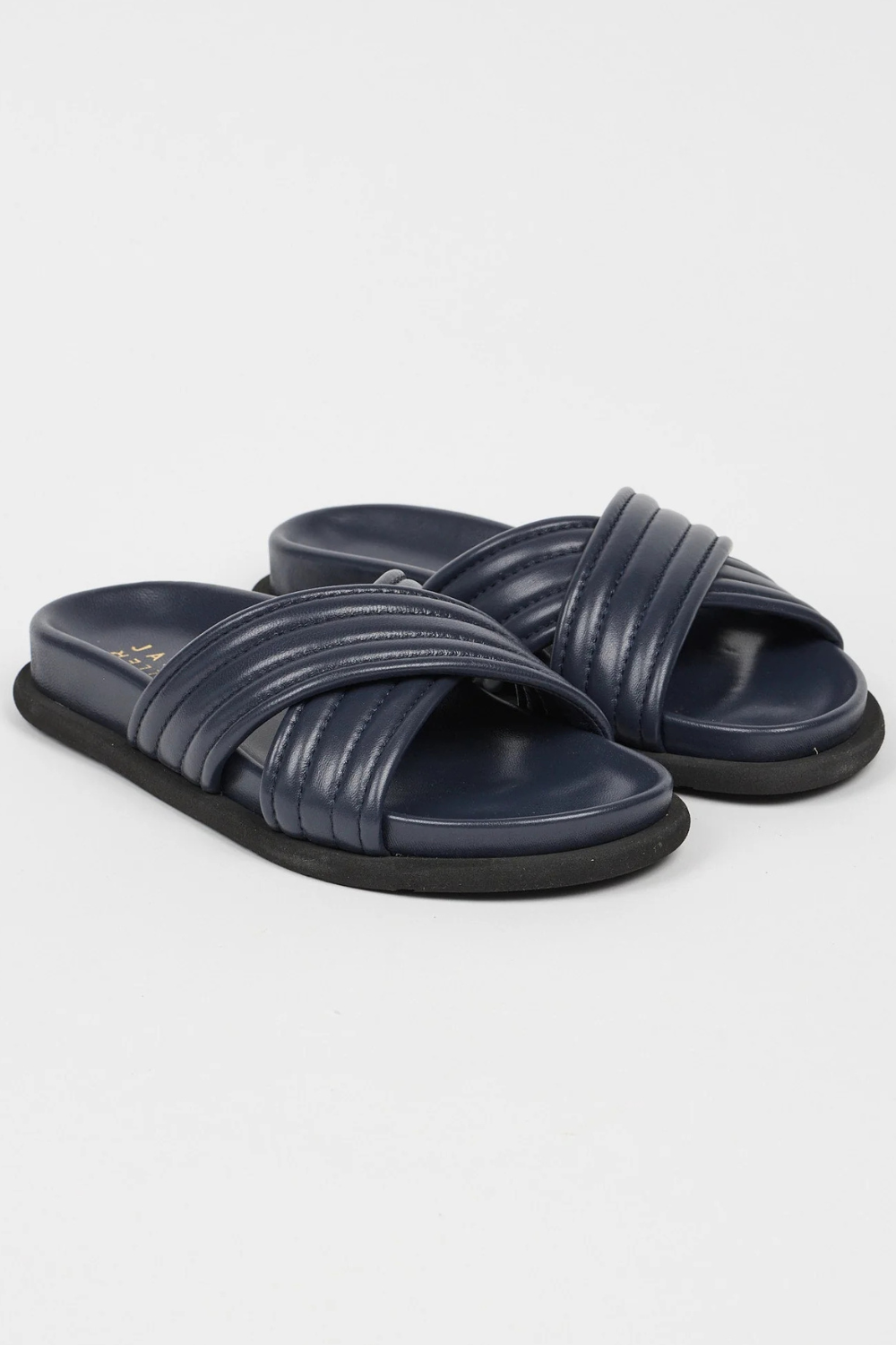 Flat lay of Jamie Haller The Pool Slide front/side view