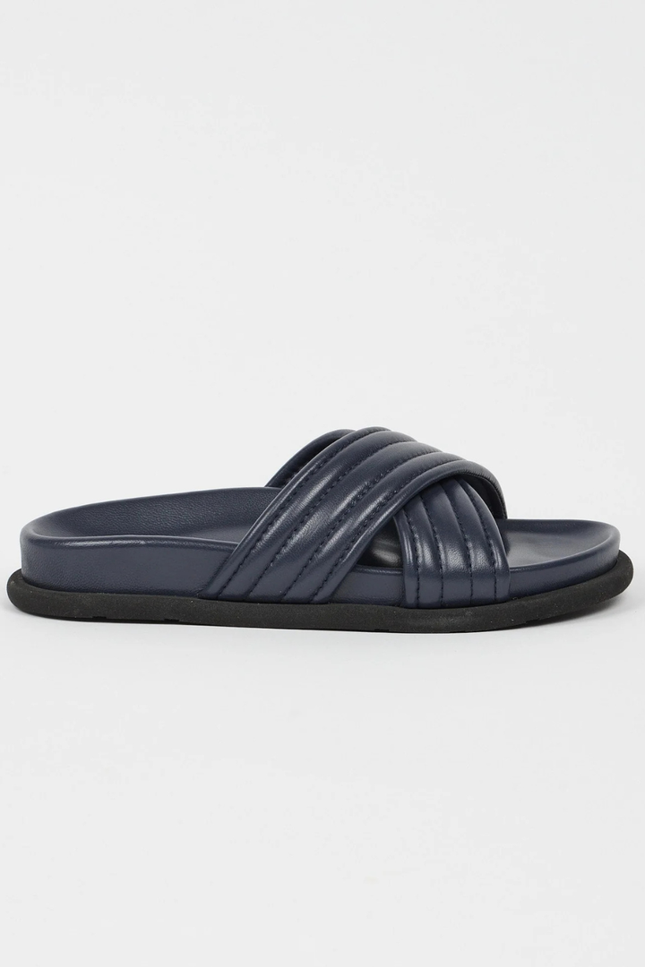 Flat lay of Jamie Haller The Pool Slide side view