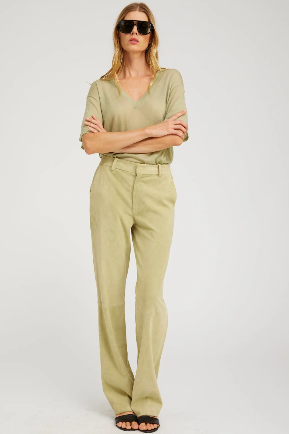 Model wearing SPRWMN Suede Baggy Lowrise Trousers front view