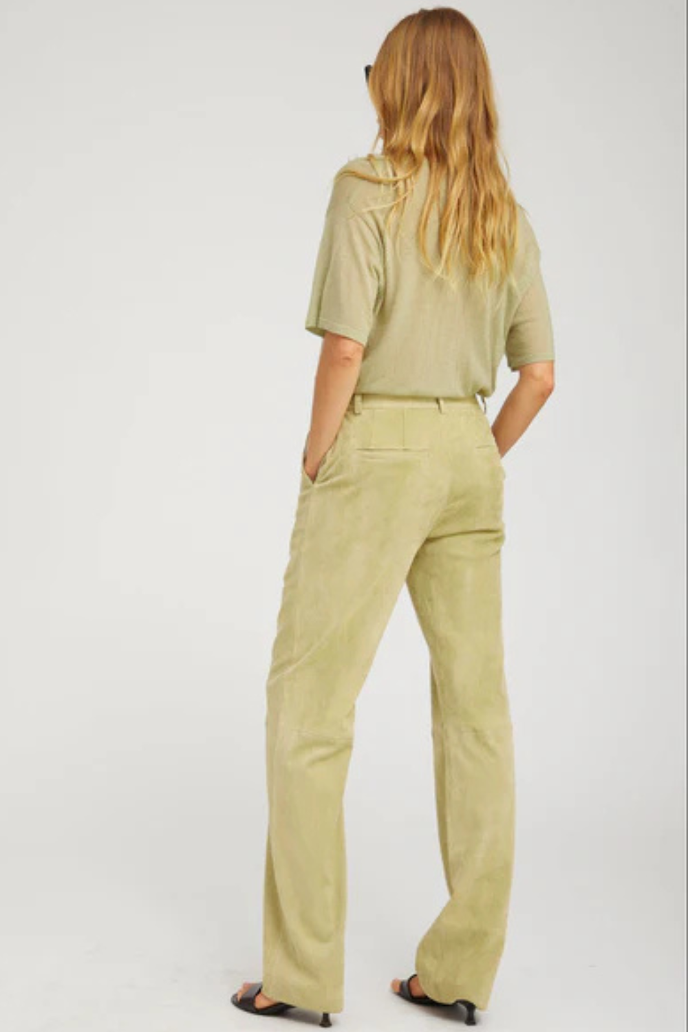 Model wearing SPRWMN Suede Baggy Lowrise Trousers rear view