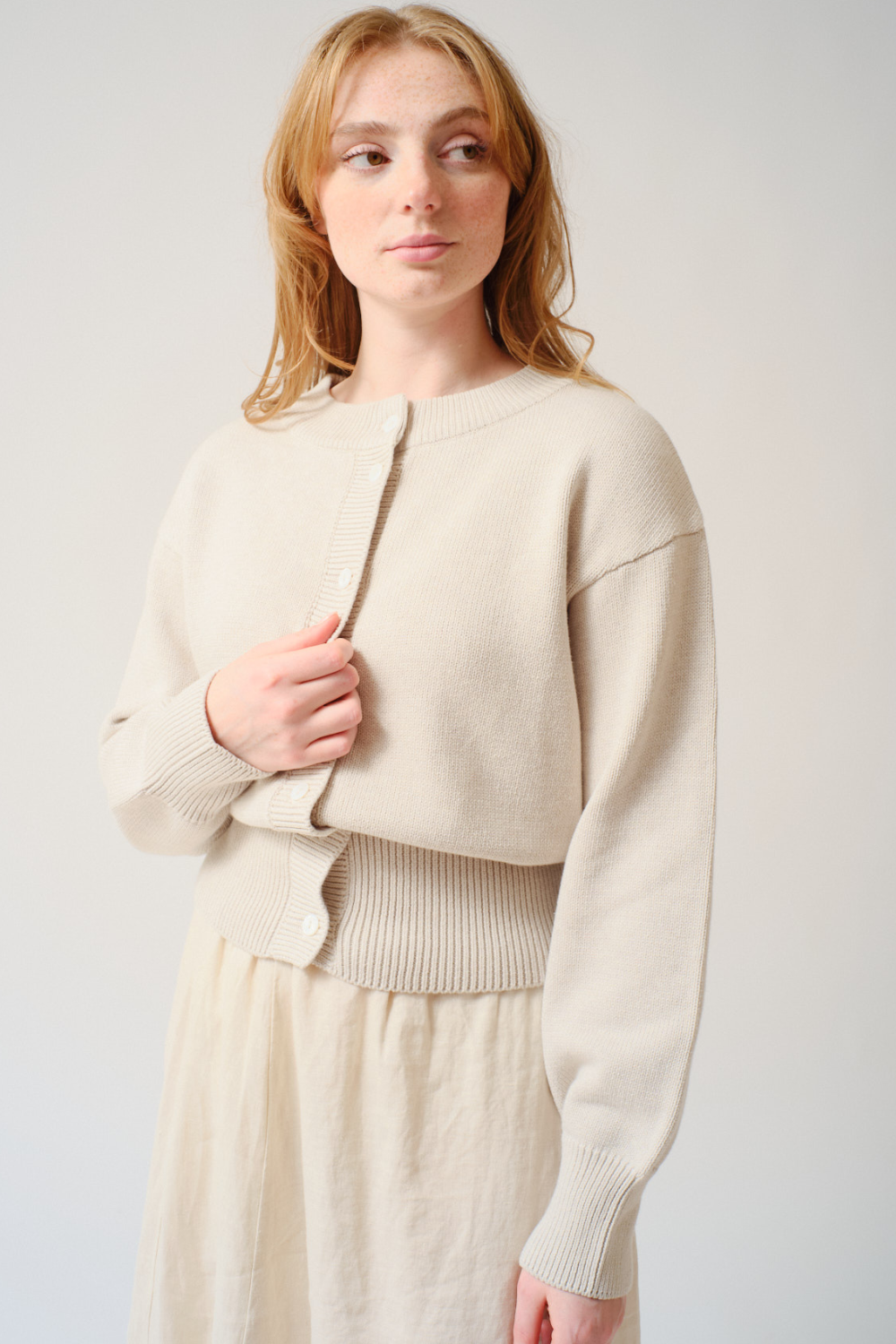 Amanda wearing Kowtow Silhouette Cardigan front view