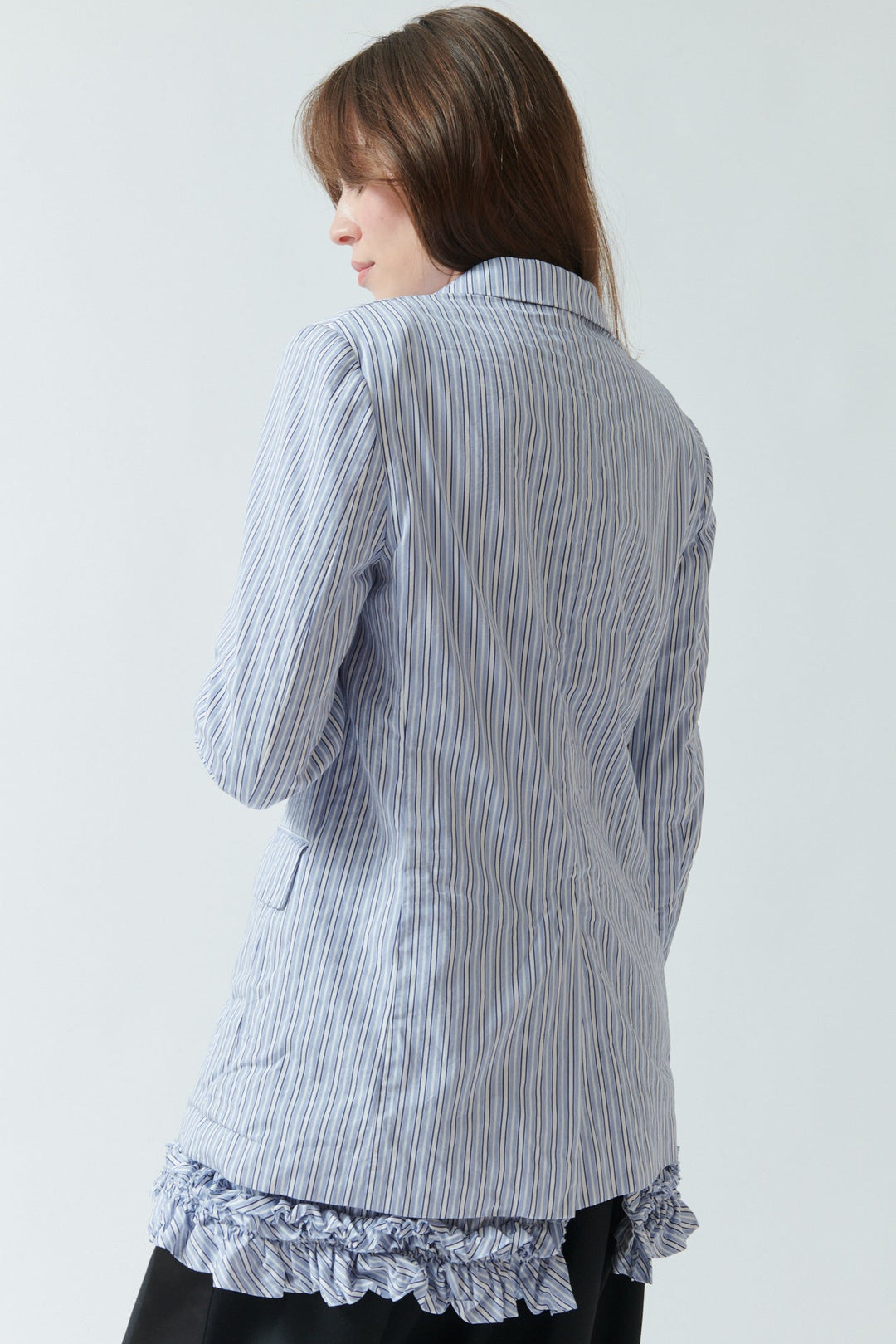 Angela wearing Comme des Garçons Layered Back Ruffle Jacket rear view
