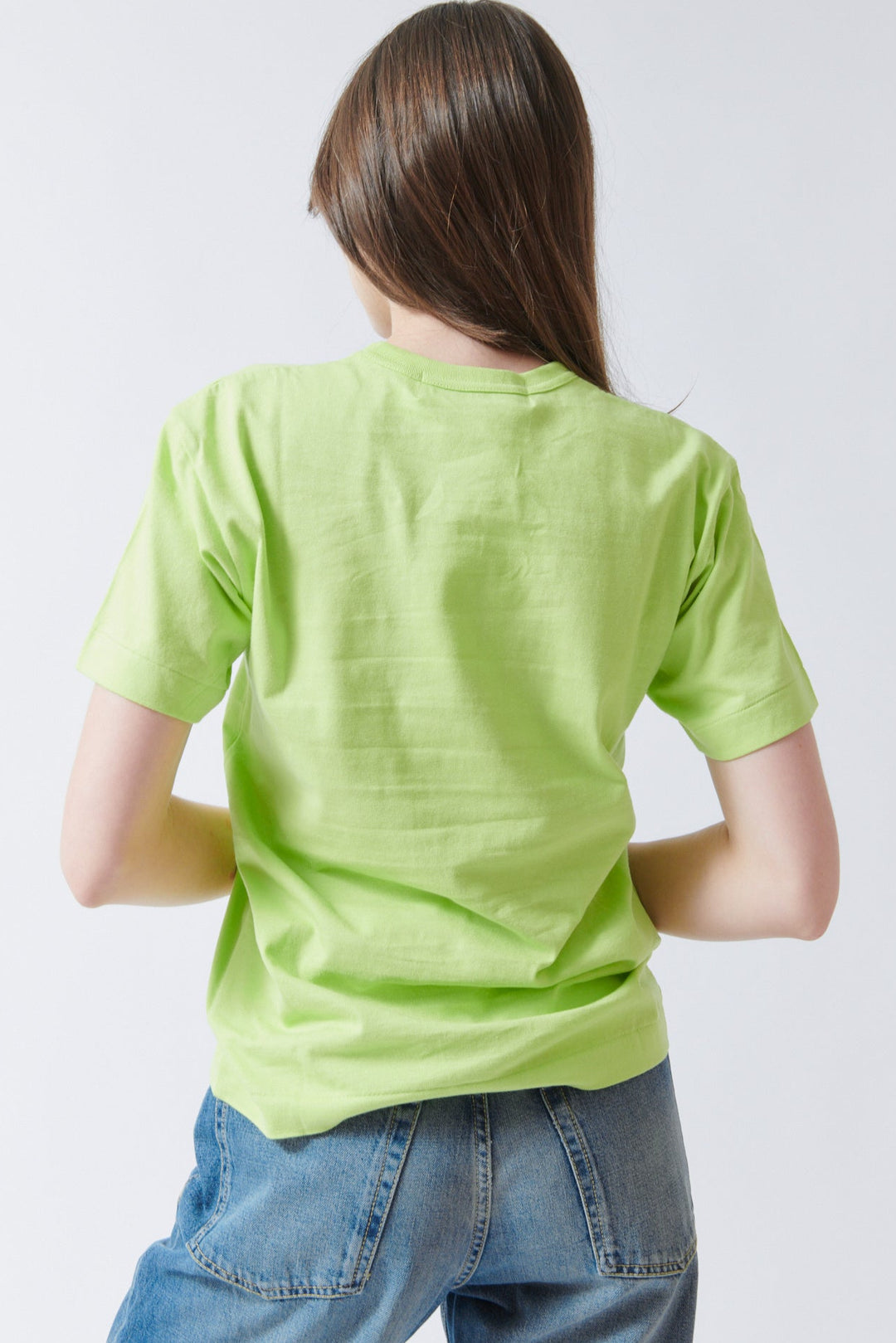 Angela wearing Comme des Garçons PLAY Logo Print T Shirt rear view