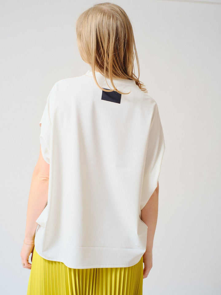 Madi wearing COG The Big Smoke Norma Top rear view