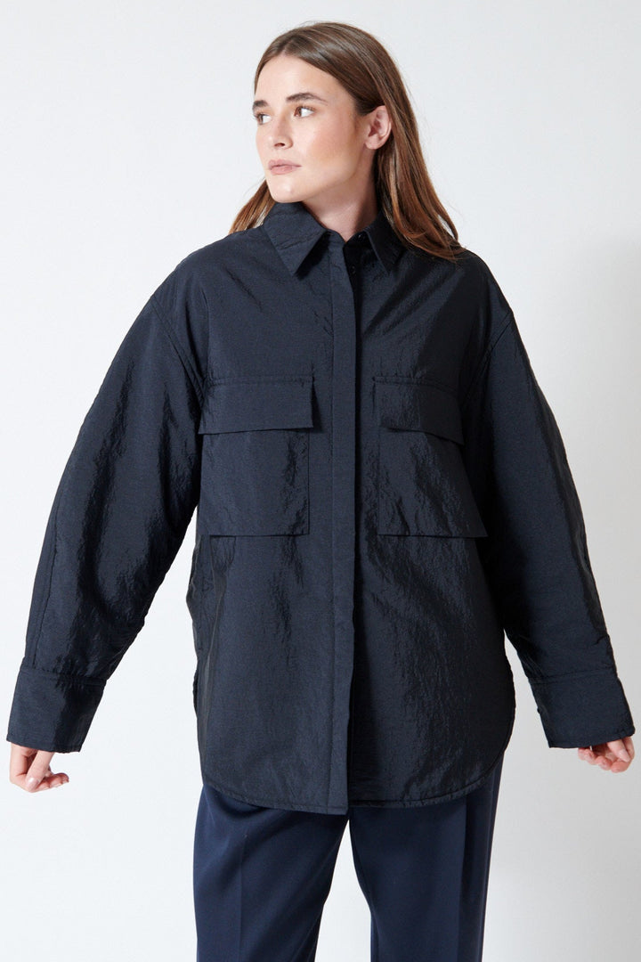 Julia wearing Christian Wijnants Toka Shirt Jacket in Navy, front view.