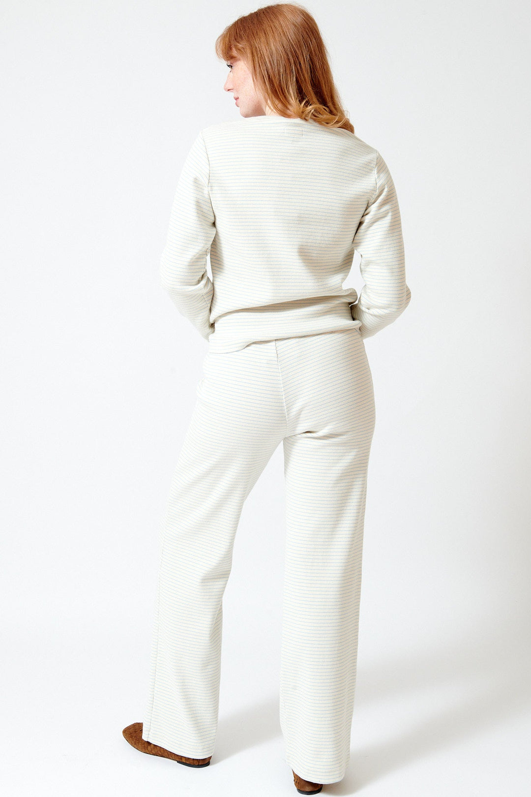 Waverly wearing Mother Denim The Quickie Greaser Ankle rear view