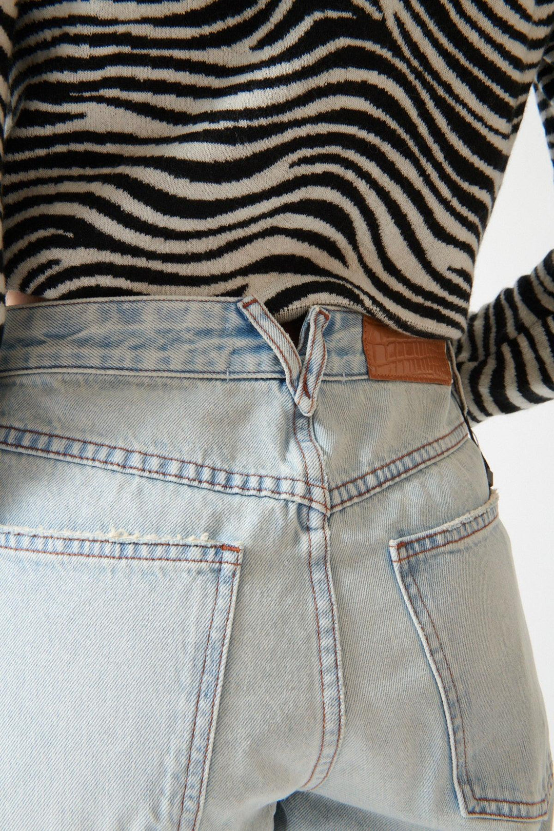 Angela wearing SPRWMN Slim Boyfriend Jean rear view