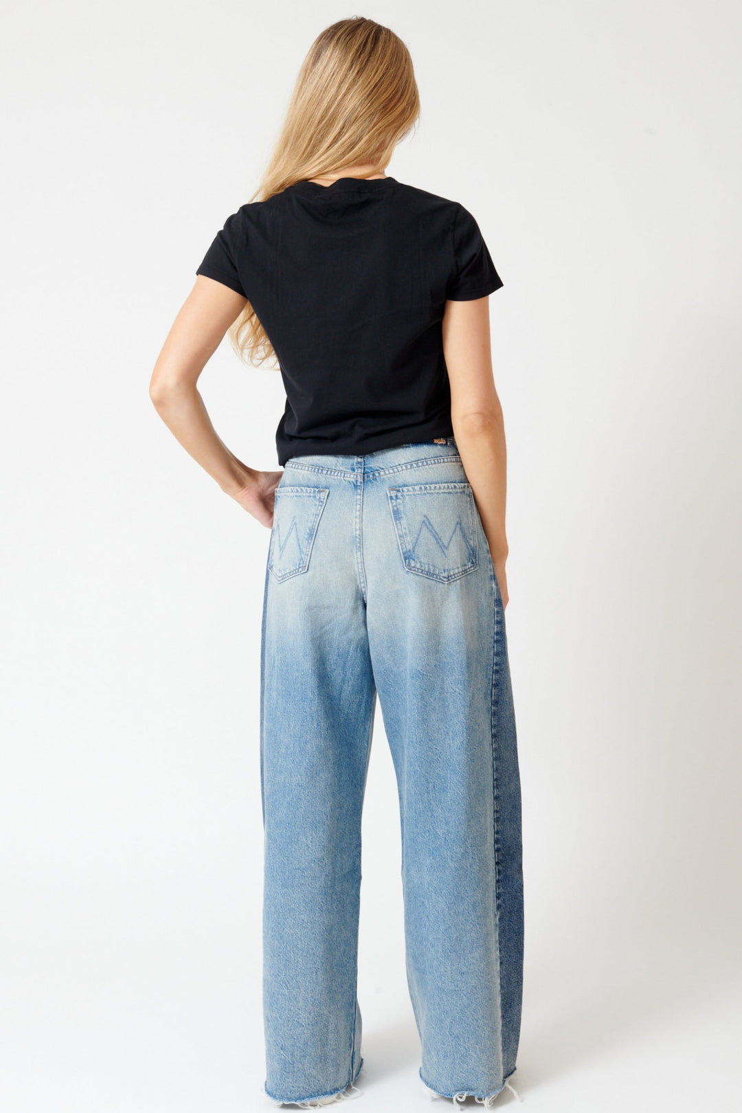 Mari wearing Mother Denim Pipe Dream Button Sneak Fray rear view