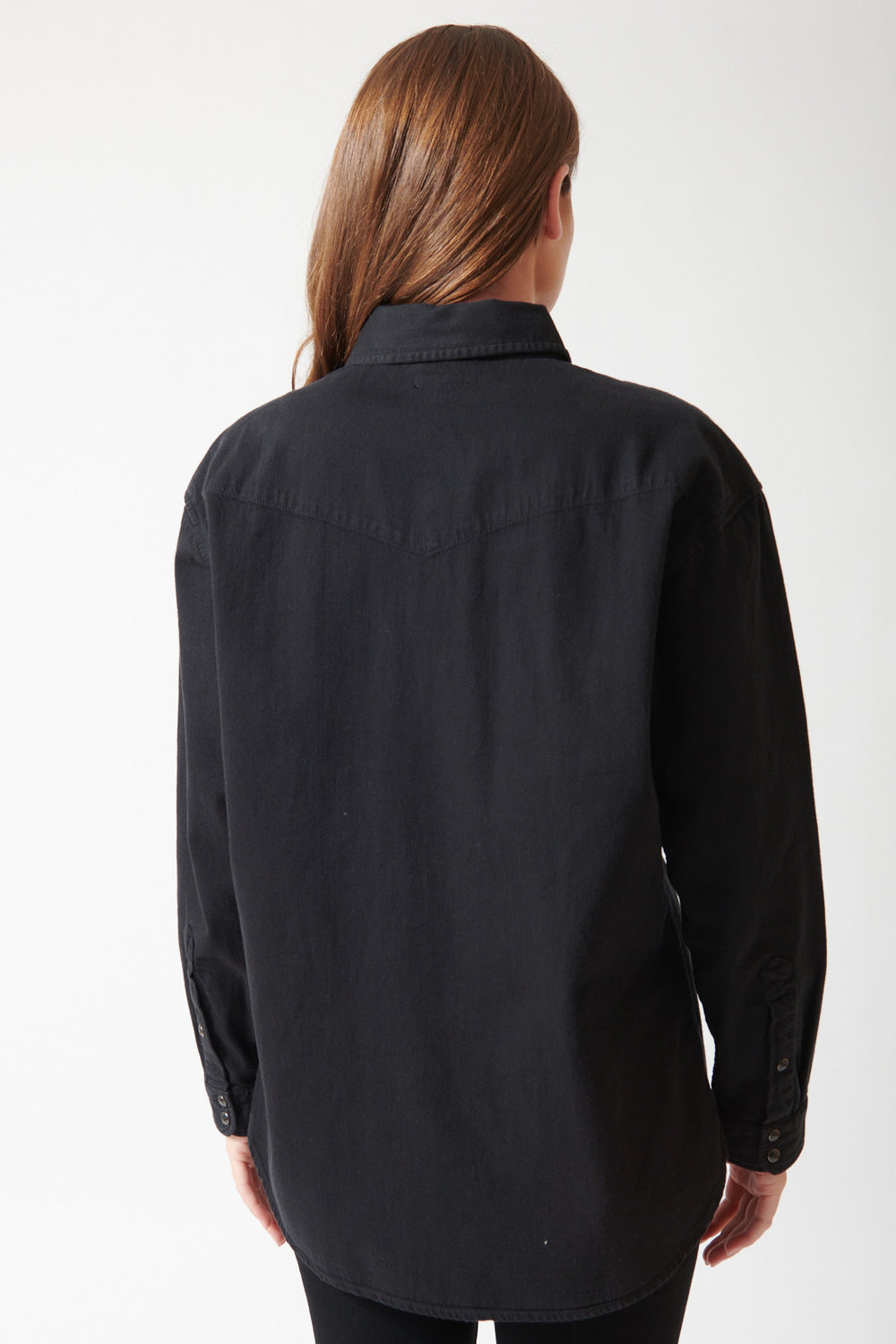 Julia wearing Mother The Exes And Ohs in Black, rear view.