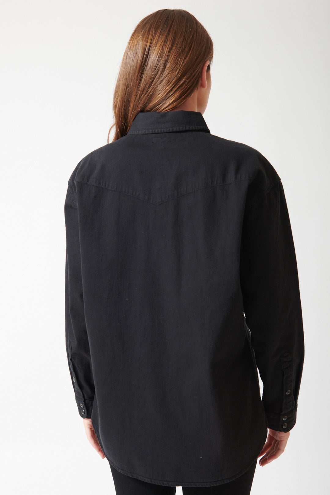 Julia wearing Mother The Exes And Ohs in Black, rear view.