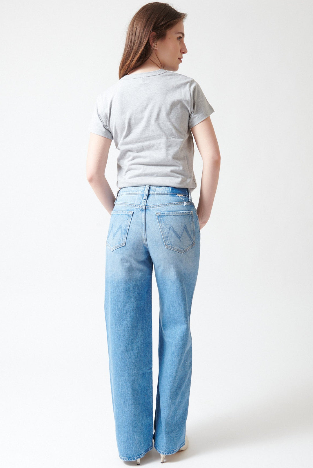 Sophie wearing Mother Denim The Rerun Zip Sneak rear view