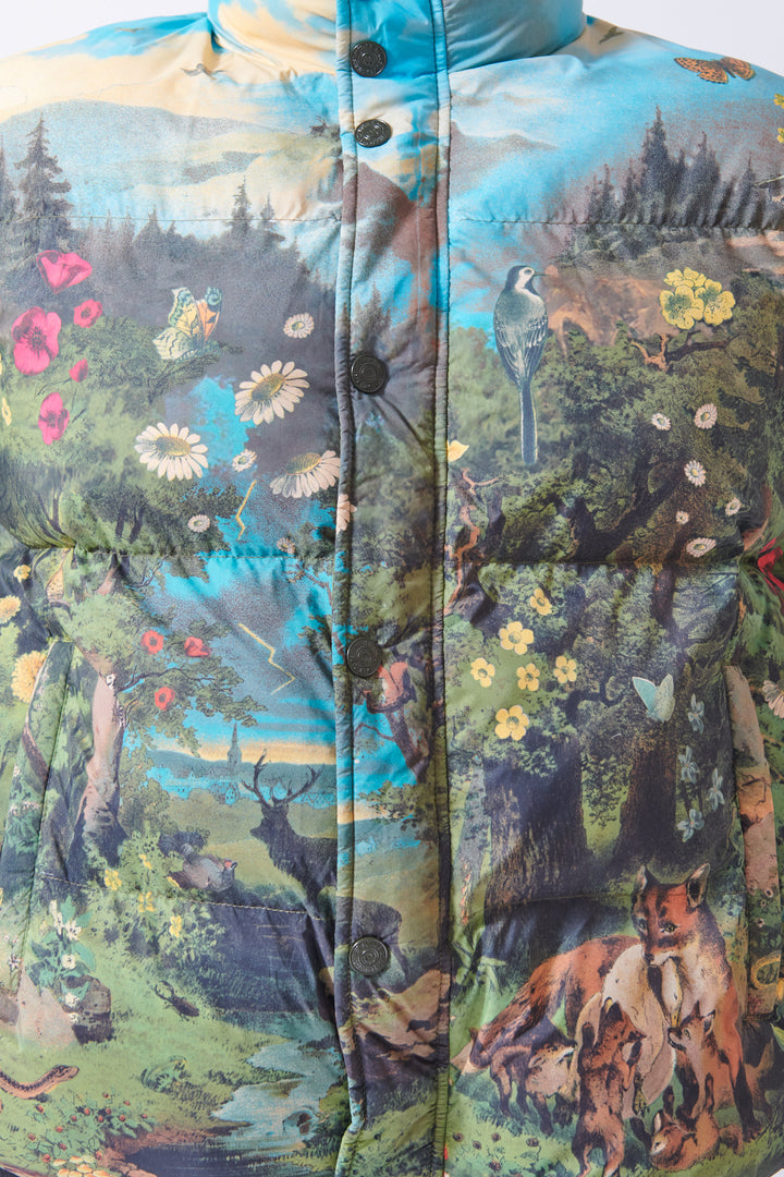 Close up of Julie Mother Denim The Drop Pillow Talk Puffer to appreciate the pastoral scenery of the print.