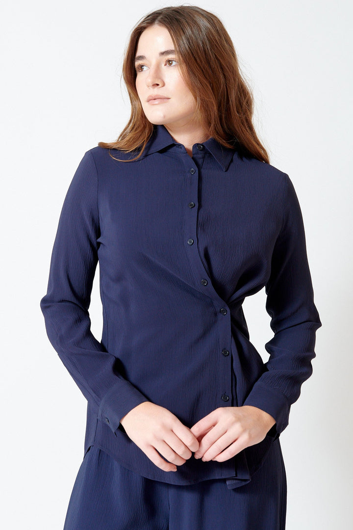Julia wearing Apiece Apart Sodi Wrap Button Up front view