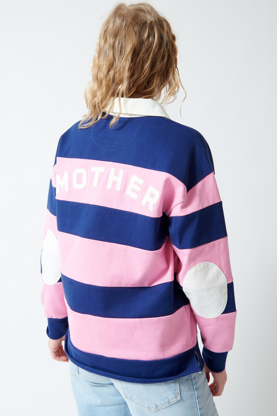 Madi wearing Mother Denim The Piece Huddle rear view