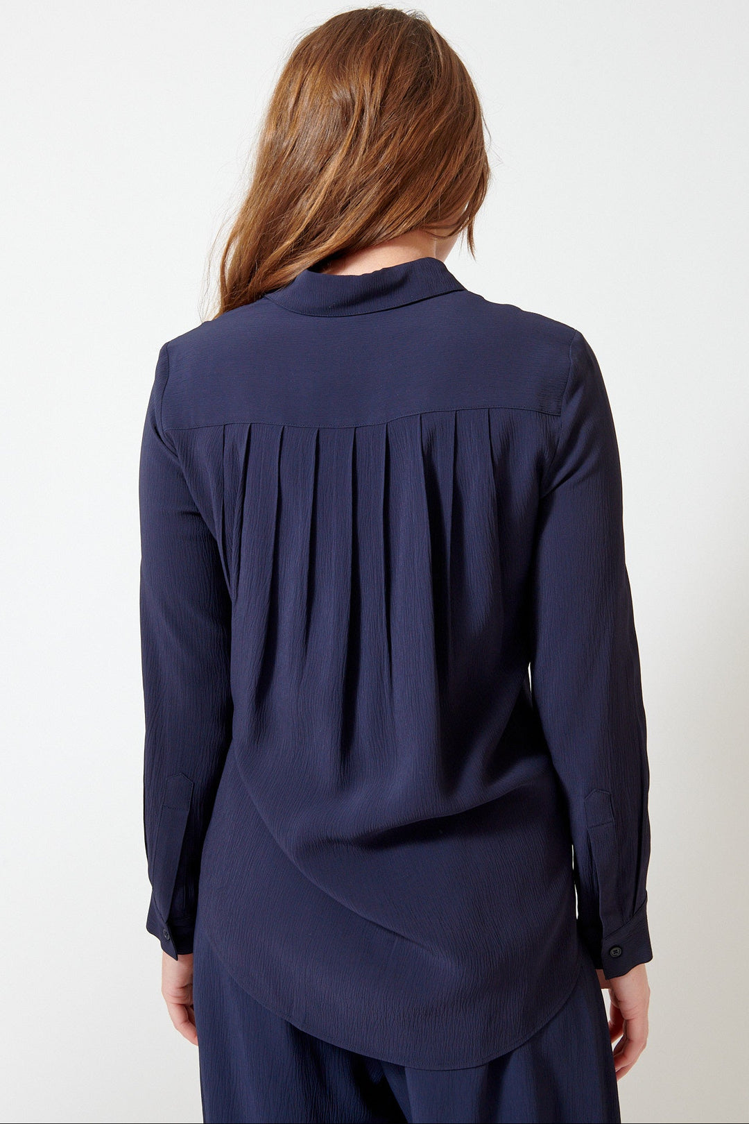 Julia wearing Apiece Apart Sodi Wrap Button Up rear view