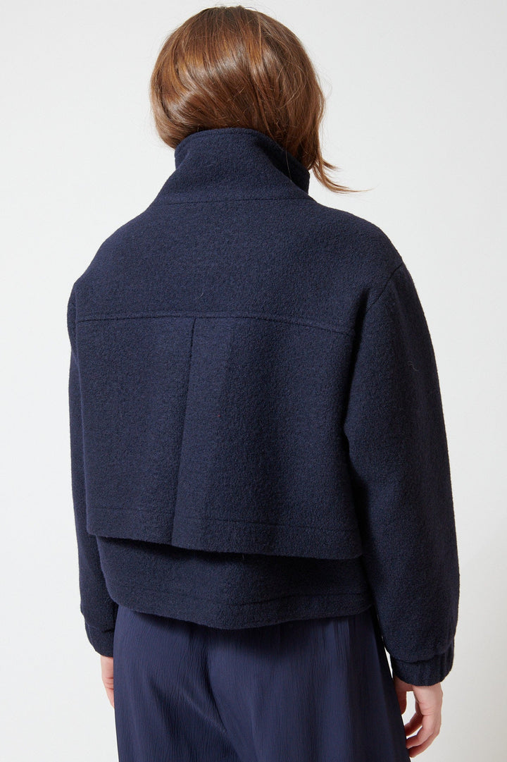 Julia wearing Apiece Apart Selva Cropped Bomber rear view