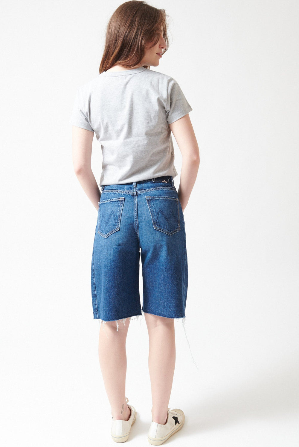 Sophie wearing Mother Denim The Half Pipe Bermuda Fray rear view