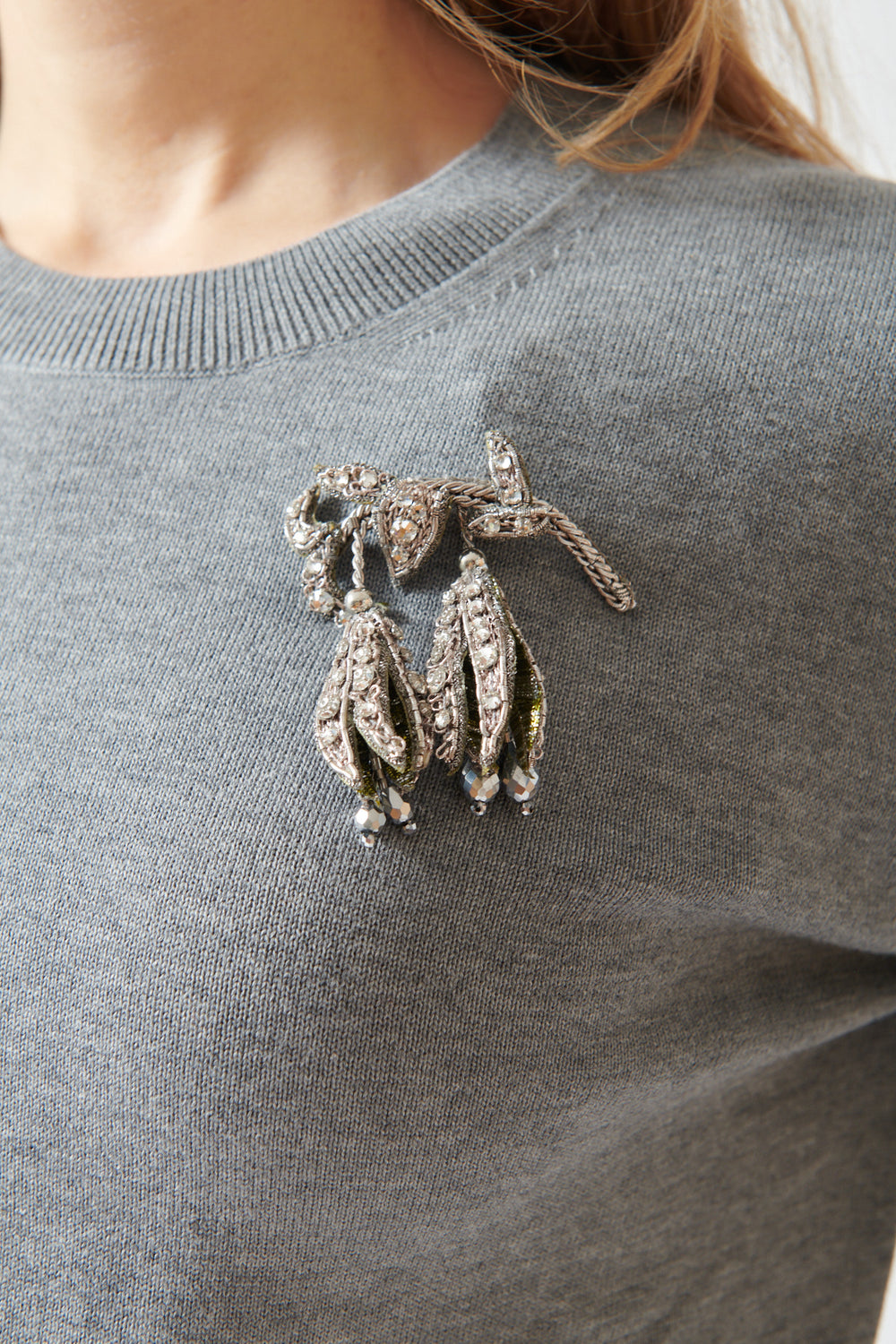 Mari wearing N°21 Cotton Crewneck Sweater With Fritillaria Meleagris Pin front/detail view