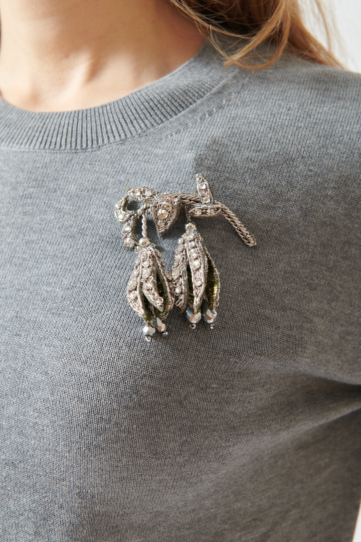 Mari wearing N°21 Cotton Crewneck Sweater With Fritillaria Meleagris Pin front/detail view