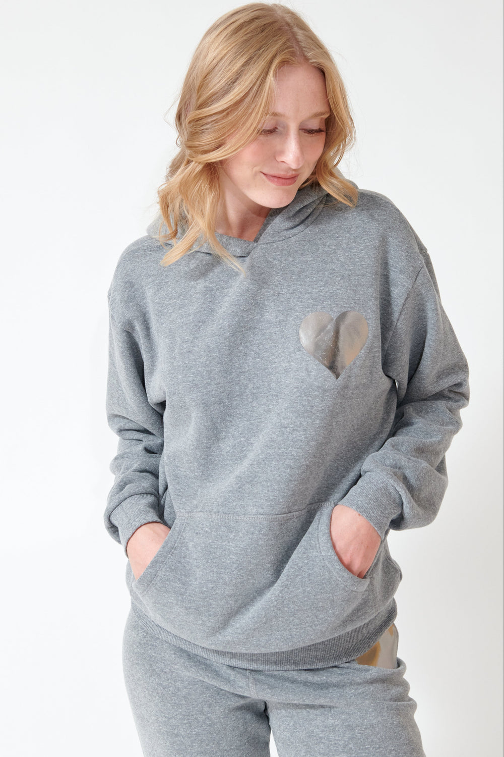 Madi earing SPRWMN Heart Hoodie front view