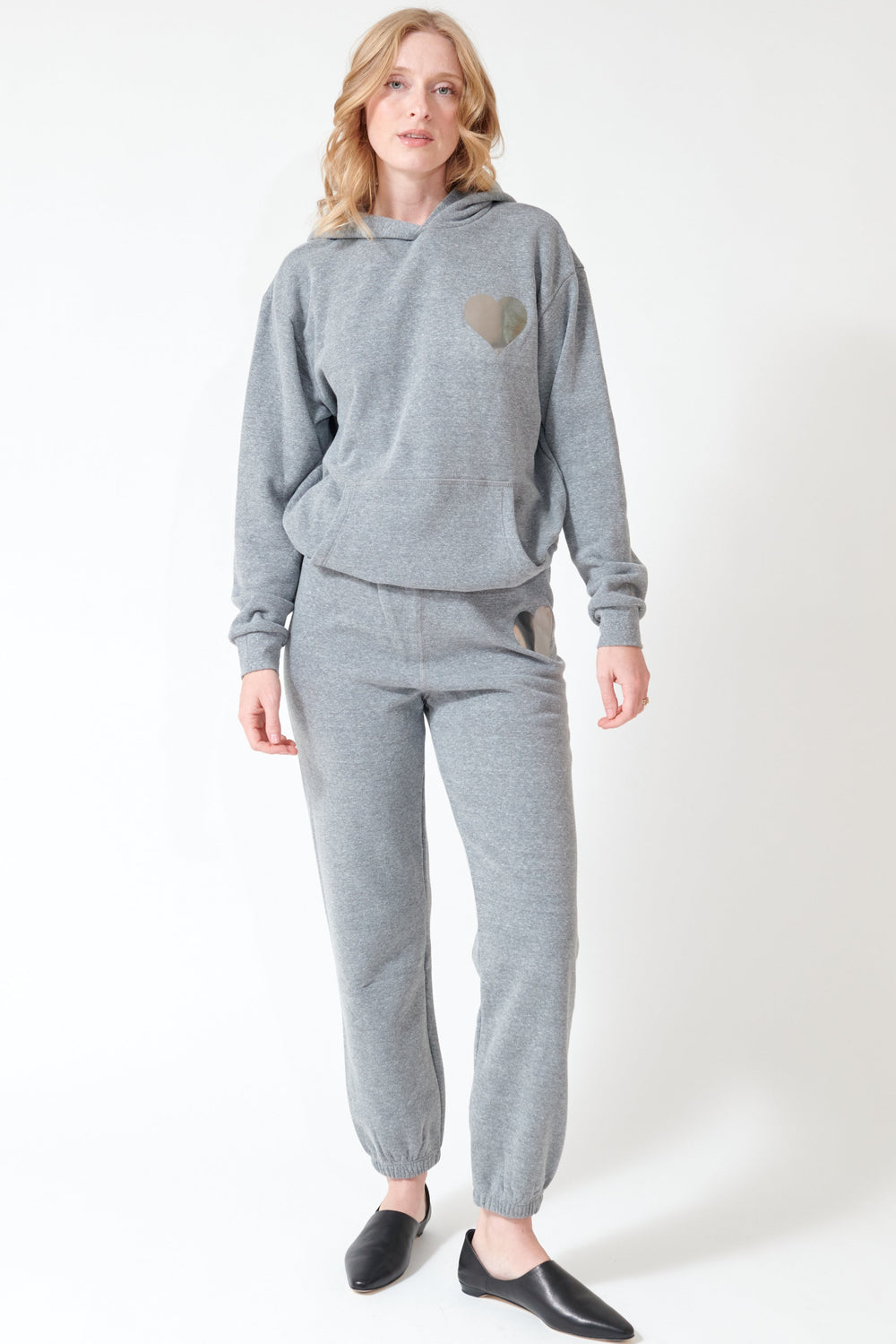 Madi wearing SPRWMN Heart Sweatpants front view