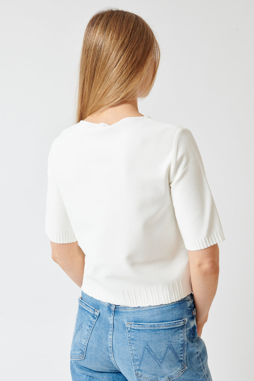 Mari wearing Base Luxury Knit Boatneck Top rear view