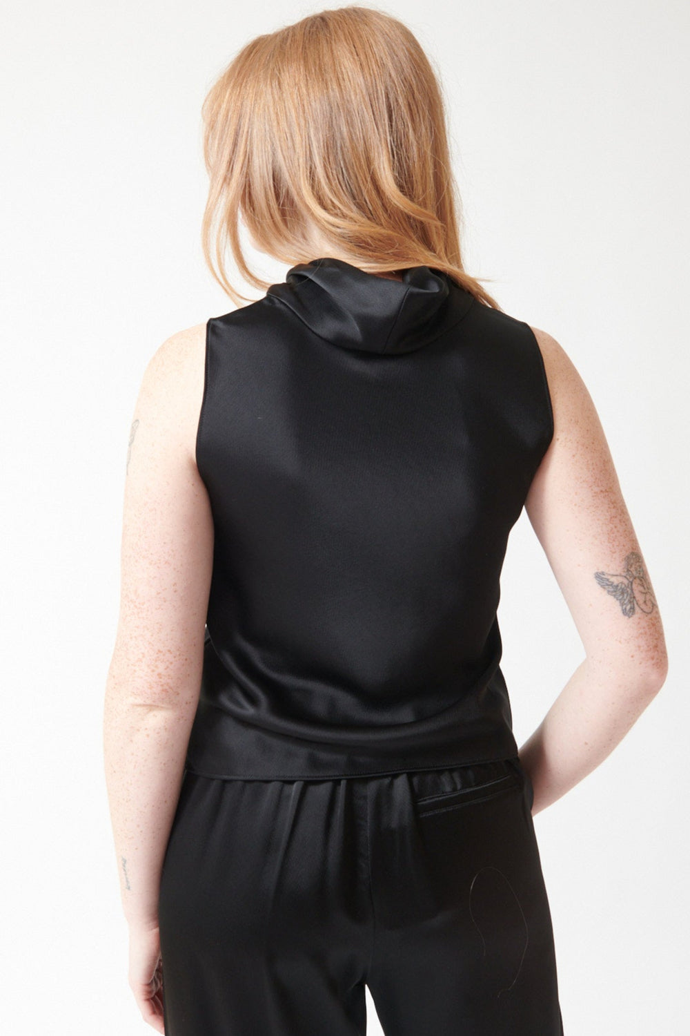 Waverly wearing LESET Barb Sleeveless Cowl Neck Top rear view