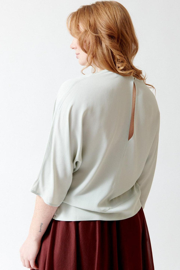 Waverly wearing Meimeij Acetate Silk Keyhole Back Top rear view
