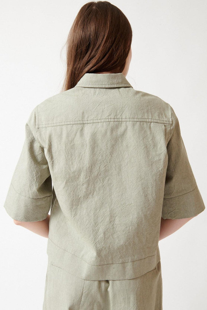 Angela wearing Odeeh Crinkled Oxford Shirt rear view