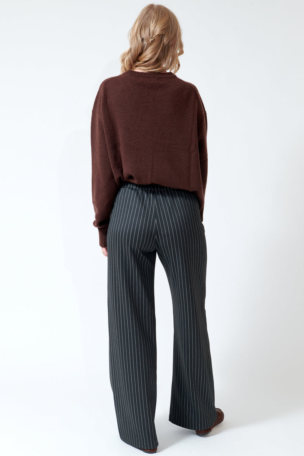 Madi wearing SPRWMN Wide Leg Easy Pants rear view