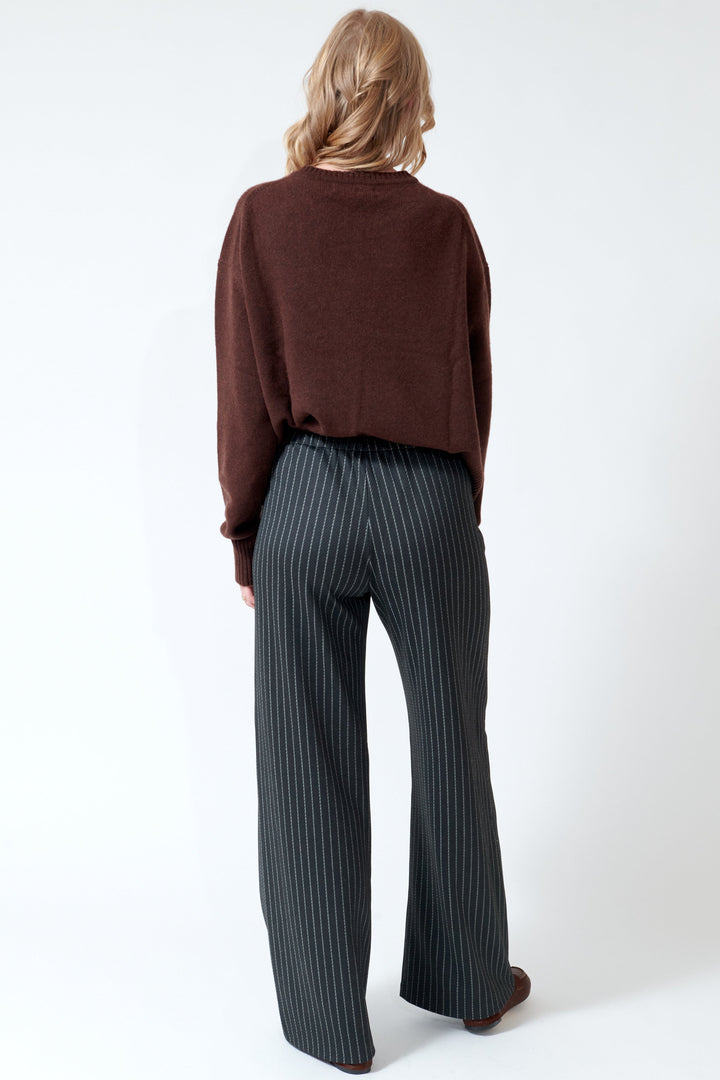Madi wearing SPRWMN Wide Leg Easy Pants rear view