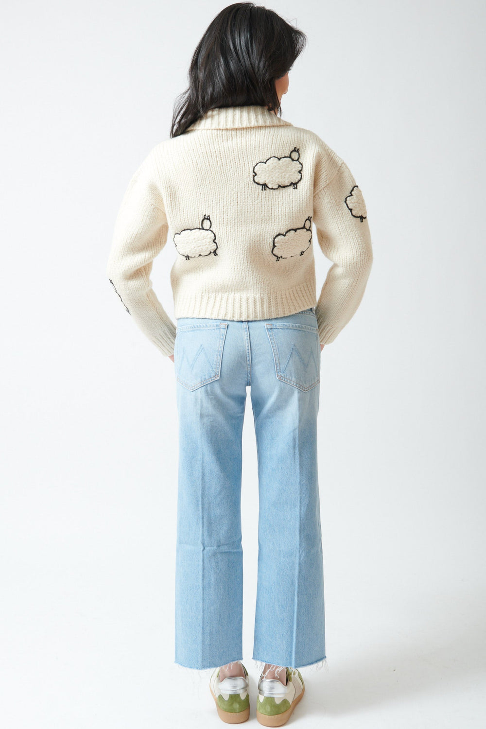 Lilly wearing Mother Denim Mid Rise Rambler Zip Ankle Fray rear view