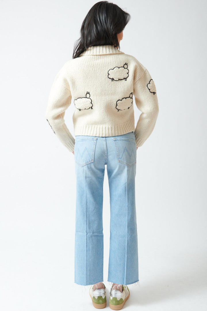 Lilly wearing Mother Denim Mid Rise Rambler Zip Ankle Fray rear view