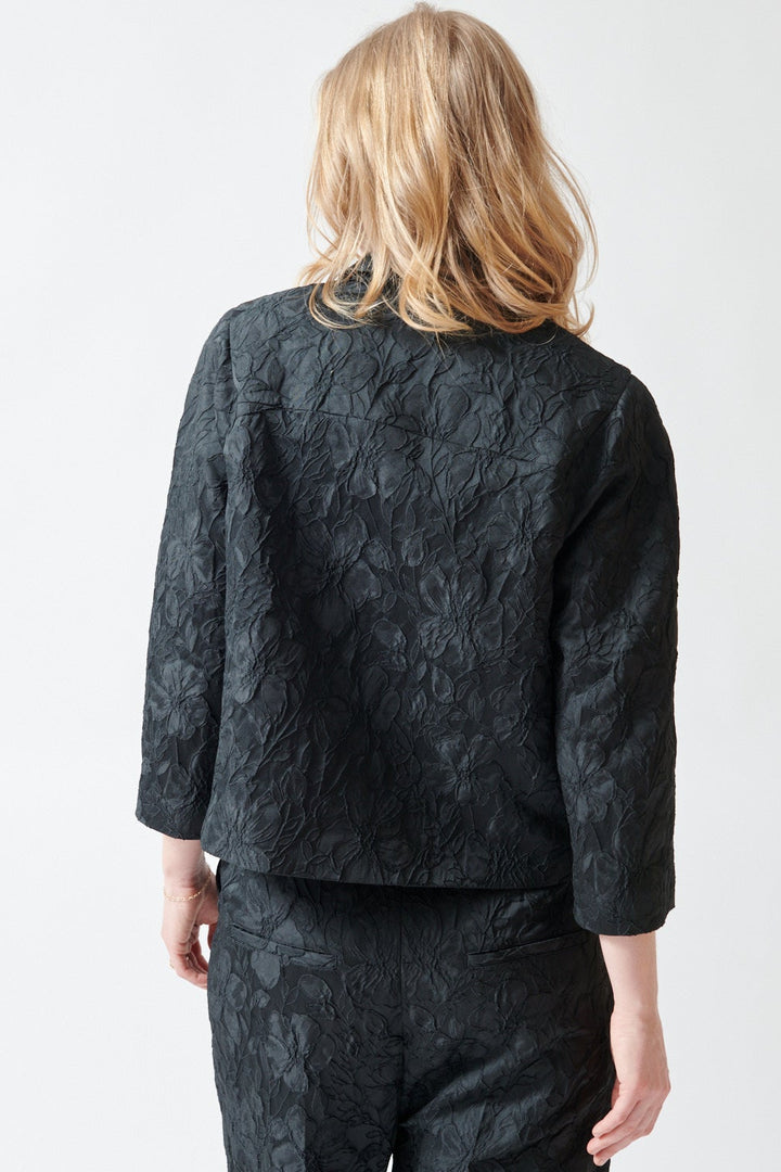 Madi wearing N°21 Textured Floral Froufrou Jacket rear view